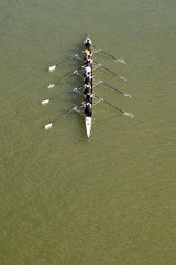Eight men rowing on Danube river