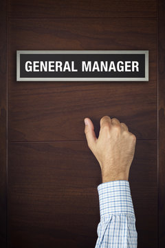 Businessman is knocking on General Manager door