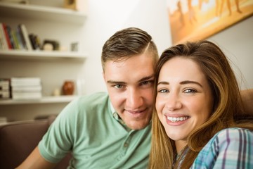 Cute couple relaxing on couch
