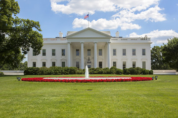 The White House in Washington. Blue sky with clouds.