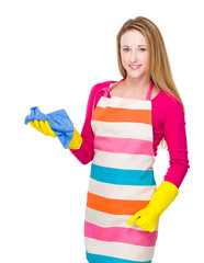 Housewife with kitchen gloves and use towel