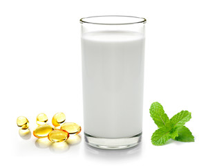 glass of milk mint and fish oil  isolated on white background