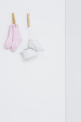 Socks and booties against white background