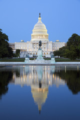 Capitol building in Washington illuminated at night.