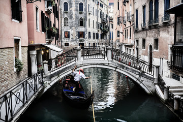 Fototapeta na wymiar Venice, Italy - Gondolier and historic tenements