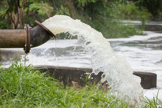 stream of artesian water from the old rusty pipe.