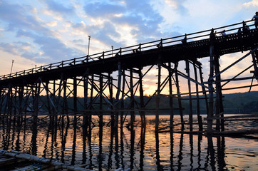 Fototapeta na wymiar Saphan Mon wooden bridge Broken at Sunset time