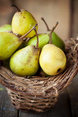 fresh pears in a wicker basket