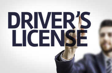 Business man pointing the text: Drivers License