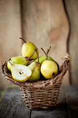 fresh pears in a wicker basket