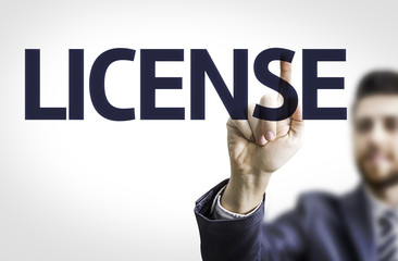 Business man pointing the text: License