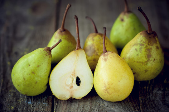 fresh pears lie on a wooden table