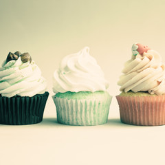 Vintage cupcakes over light background