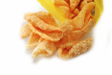 Unhealthy Pork Rinds Falling out of a Bag