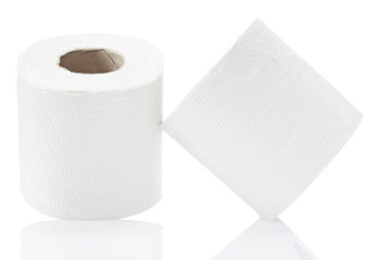 Toilet rolls leaning against white background