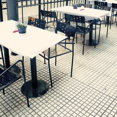 Restaurant tables in a sidewalk