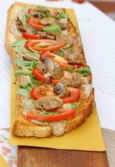 Italian bruschetta topped Arugula and tomato mushrooms