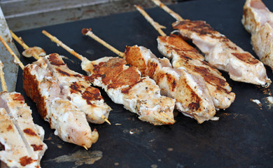 meat skewers cooked at boiling plate