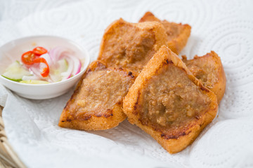 Roast pork with a side dish with a white background.