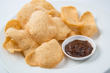 Crispy shrimp with chili sauce on a white backgroun