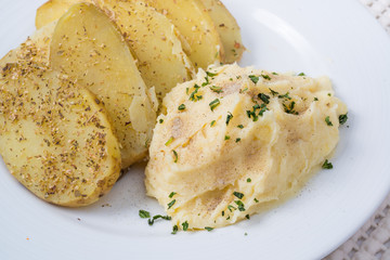 Mashed potatoes and biscuits on a white background.