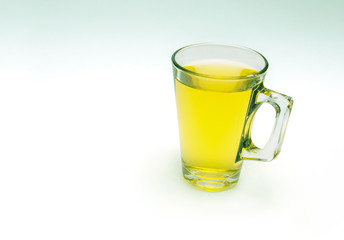 tea in a transparent cup on white background