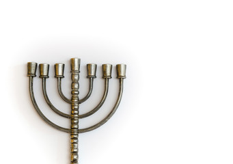 Menorah, the traditional Jewish candelabrum, on white background