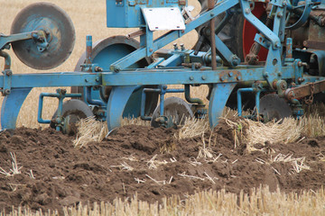 A Classic Agricultural Plough Cutting a Deep Furrow.