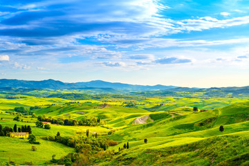 Fototapeta premium Tuscany, rural sunset landscape. Countryside farm, white road an