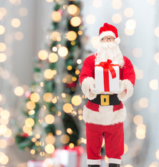 man in costume of santa claus with gift box