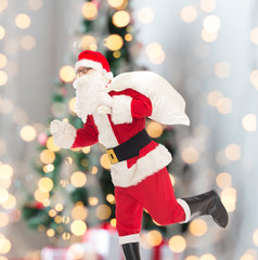 man in costume of santa claus with bag