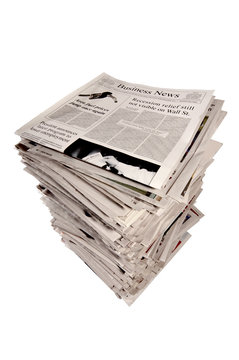 Stack of Newspapers With Business Edition On Top