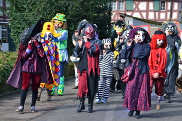 Fototapeta na wymiar Colourful parade of carnival masks in Riehen, Switzerland