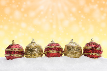 Christmas balls on snow, christmas background with bokeh