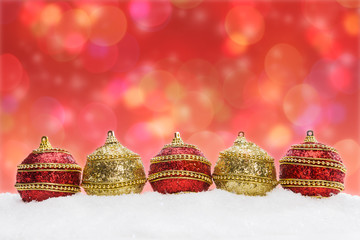 Christmas balls in snow, background with bokeh