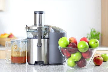 Apple juice on juicer machine - juicing