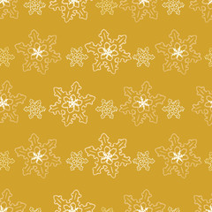 Seamless pattern of golden snowflakes