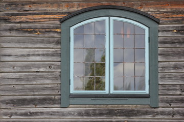 Architectural detail (wall and window) of log house
