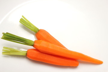 fresh baby carrot on white background.