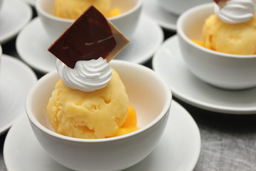 Vanilla ice cream in white bowl.