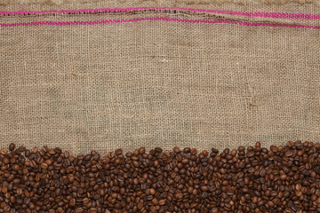 Coffee beans on a jute background