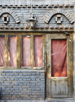 Wooden door and brick wall window shop