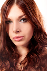 Portrait of young woman with red hair