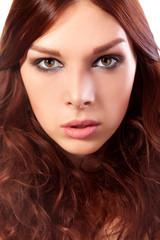 Fototapeta premium Portrait of young woman with red hair