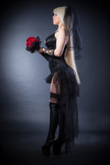 black widow in grief  with flowers  with a veil