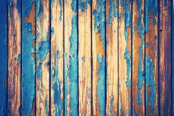 Vintage background from old wooden wall with peeling paint