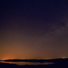 Obraz na płótnie Canvas Smooth surface of the lake on a background the starry sky