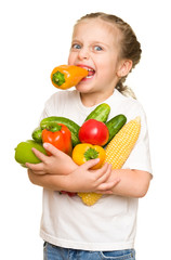 little girl with fruits and vegetables on white