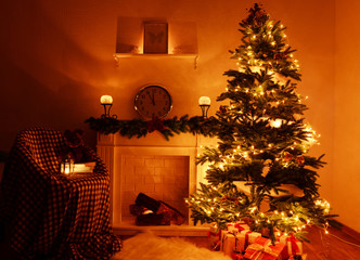 Christmas tree near fireplace in room