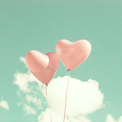 Two pink heart-shaped balloons © Andreka Photography